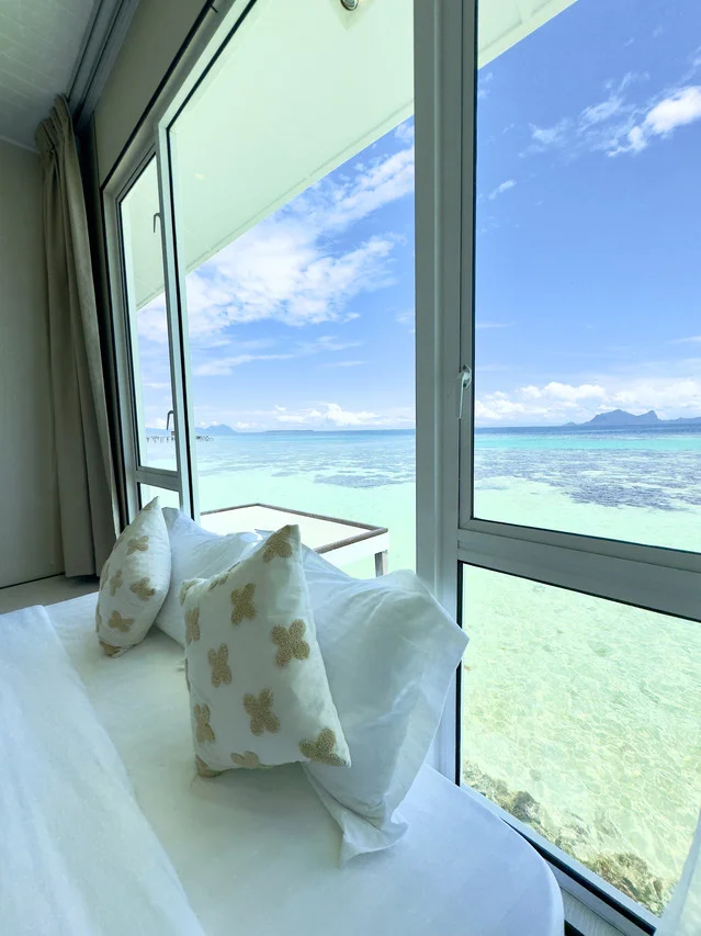 Bed facing ocean views, Family Ocean-View Room, Bubblefish Water Villa