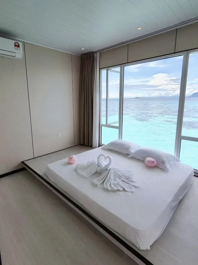 Twin bedroom with glass floors, Family Ocean-View Room, Bubblefish Water Villa