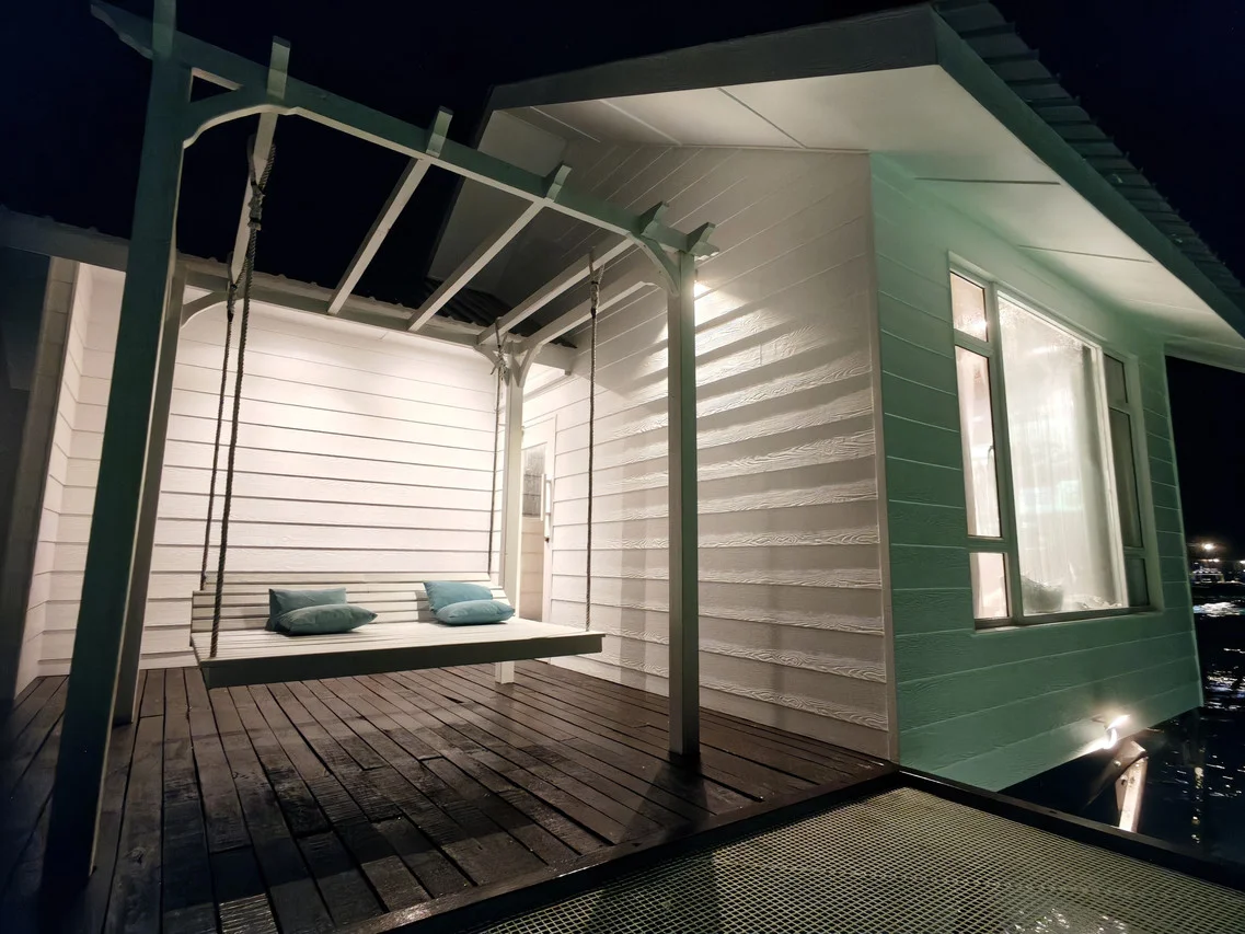 Romantic night balcony with hammock swing, Bubblefish Water Villa